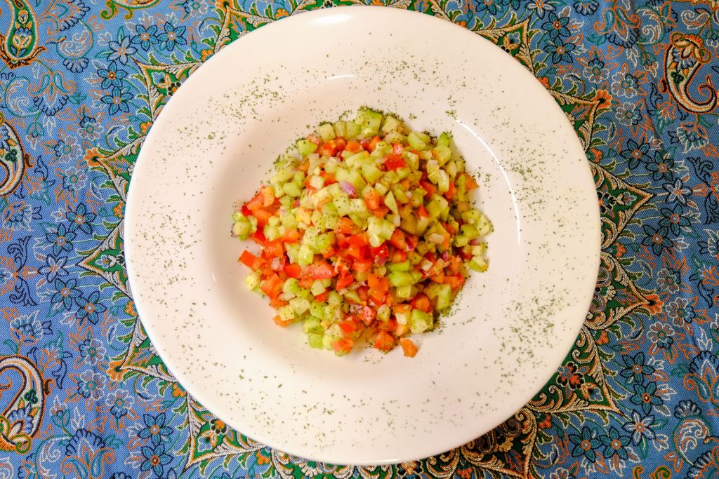Authentic Shirazi Salad with cucumber, tomato, and dried mint at PARSI Madrid.