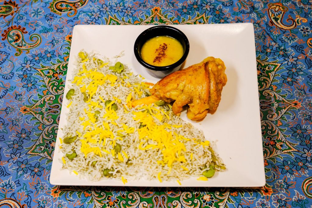 Baghali Polo ba Mahiche: Succulent lamb shank with fragrant dill and fava bean rice at PARSI Madrid.