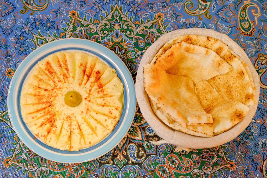 Silky Hummus Parsi: smooth chickpea purée with premium tahini and olive oil at PARSI Madrid.