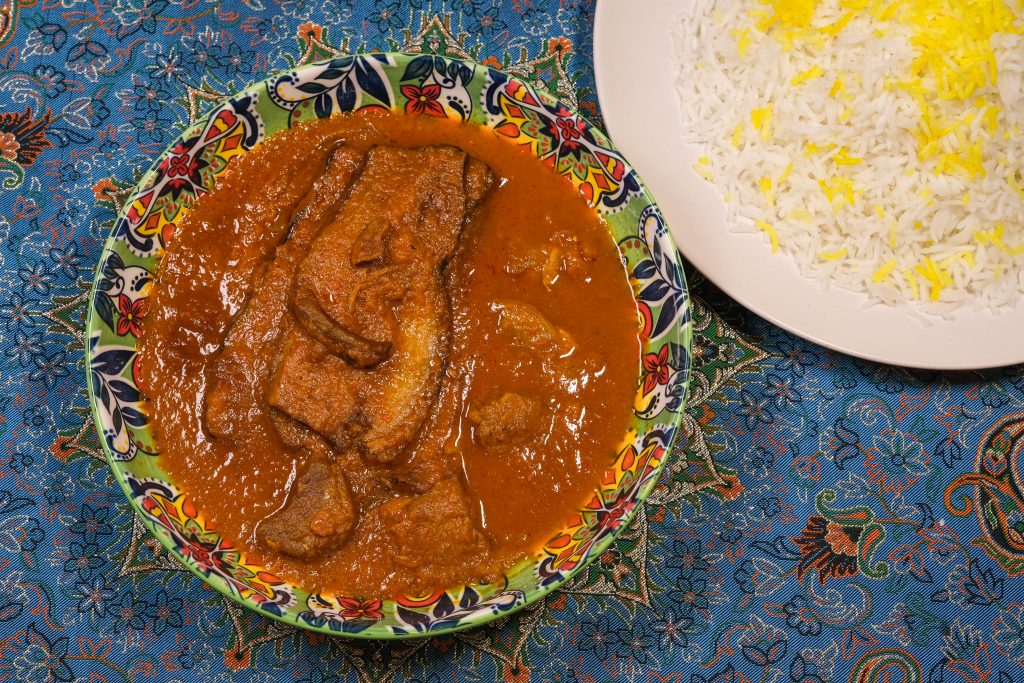Khoresht Bademjan: silky fried eggplant and lamb stew in a savory tomato sauce at PARSI Madrid.